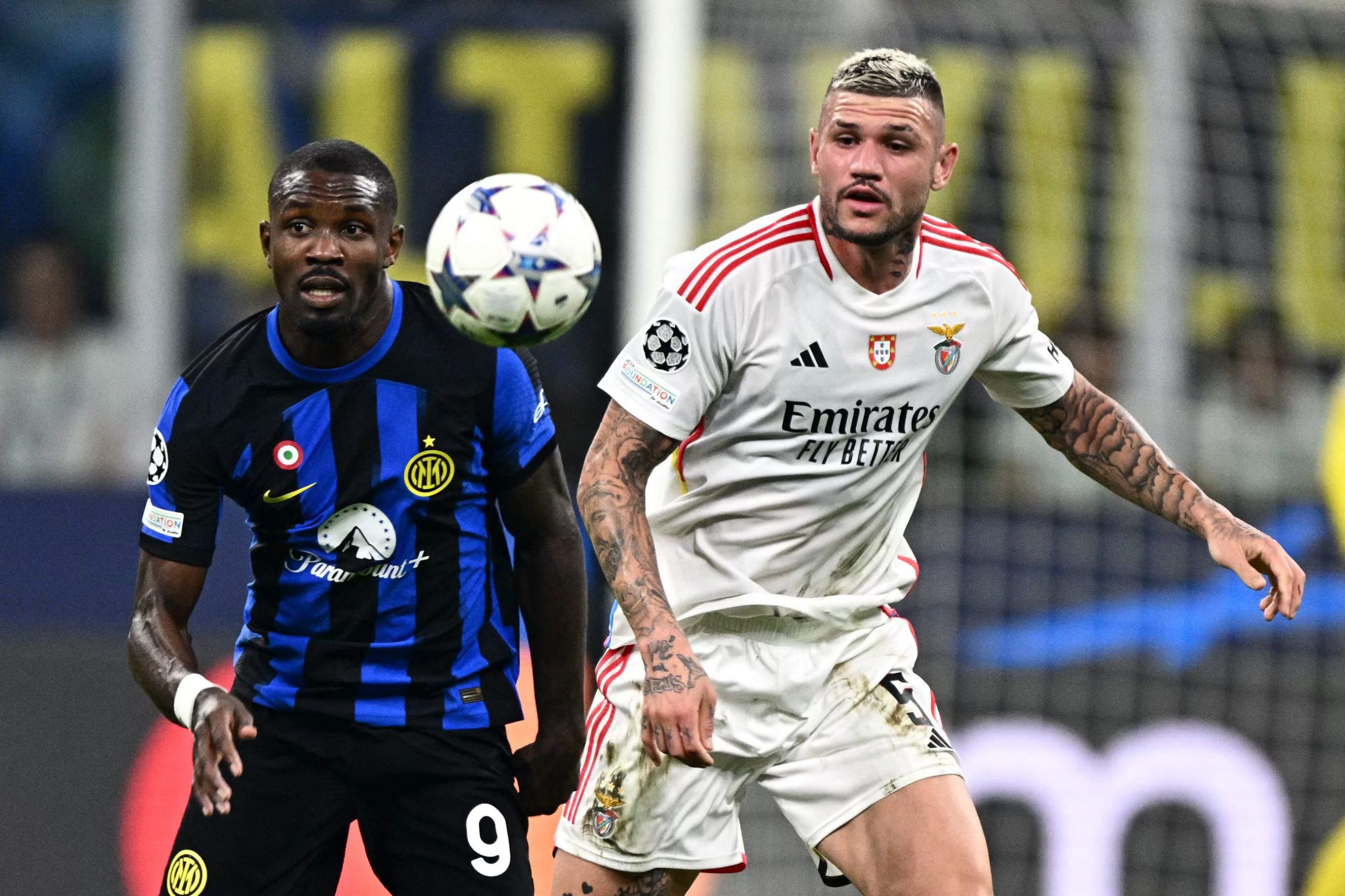 Inter Milan's French forward #09 Marcus Thuram and Benfica's Brazilian defender #05 Morato eye the ball during the UEFA Champions League 1st round day 2 Group D football match Inter Milan vs Benfica at the San Siro stadium in Milan on October 3, 2023. (Photo by GABRIEL BOUYS / AFP) (Photo by GABRIEL BOUYS/AFP via Getty Images)