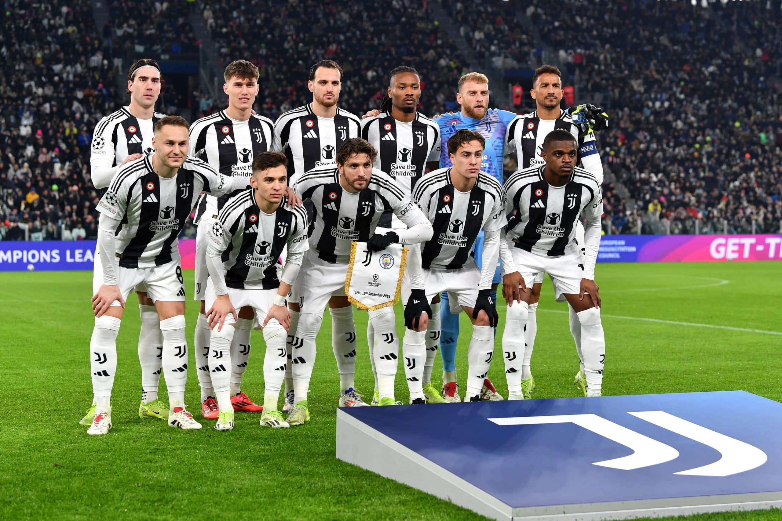 TURIN, ITALY - DECEMBER 11: Juventus players pose for a team photo ahead of the UEFA Champions League 2024/25 League Phase MD6 match between Juventus and Manchester City at Juventus Stadium on December 11, 2024 in Turin, Italy. (Photo by Valerio Pennicino/Getty Images)