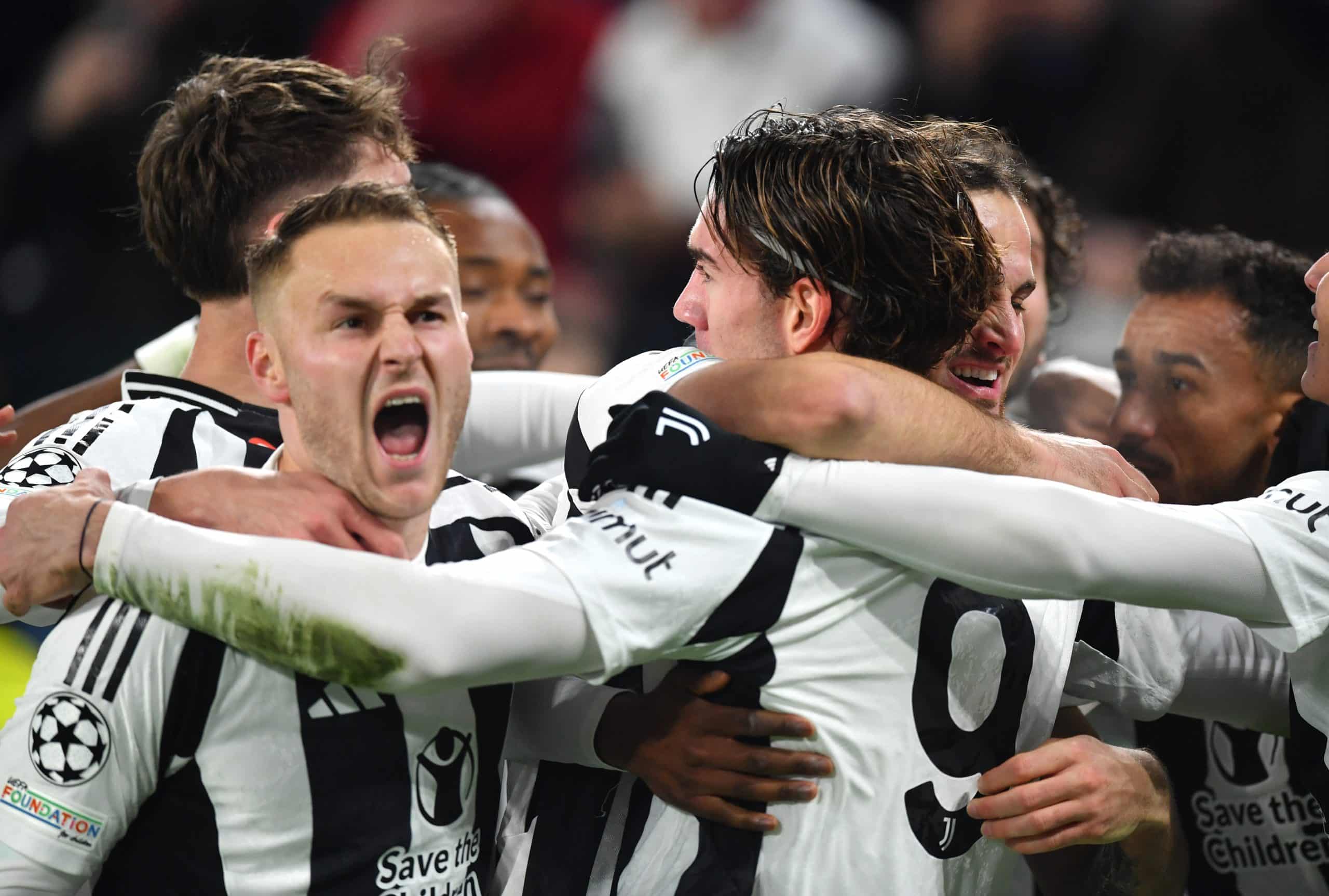 TURIN, ITALY - DECEMBER 11: Dusan Vlahovic of Juventus celebrates with his teammates after scoring his team's first goal during the UEFA Champions League 2024/25 League Phase MD6 match between Juventus and Manchester City at Juventus Stadium on December 11, 2024 in Turin, Italy. (Photo by Valerio Pennicino/Getty Images)