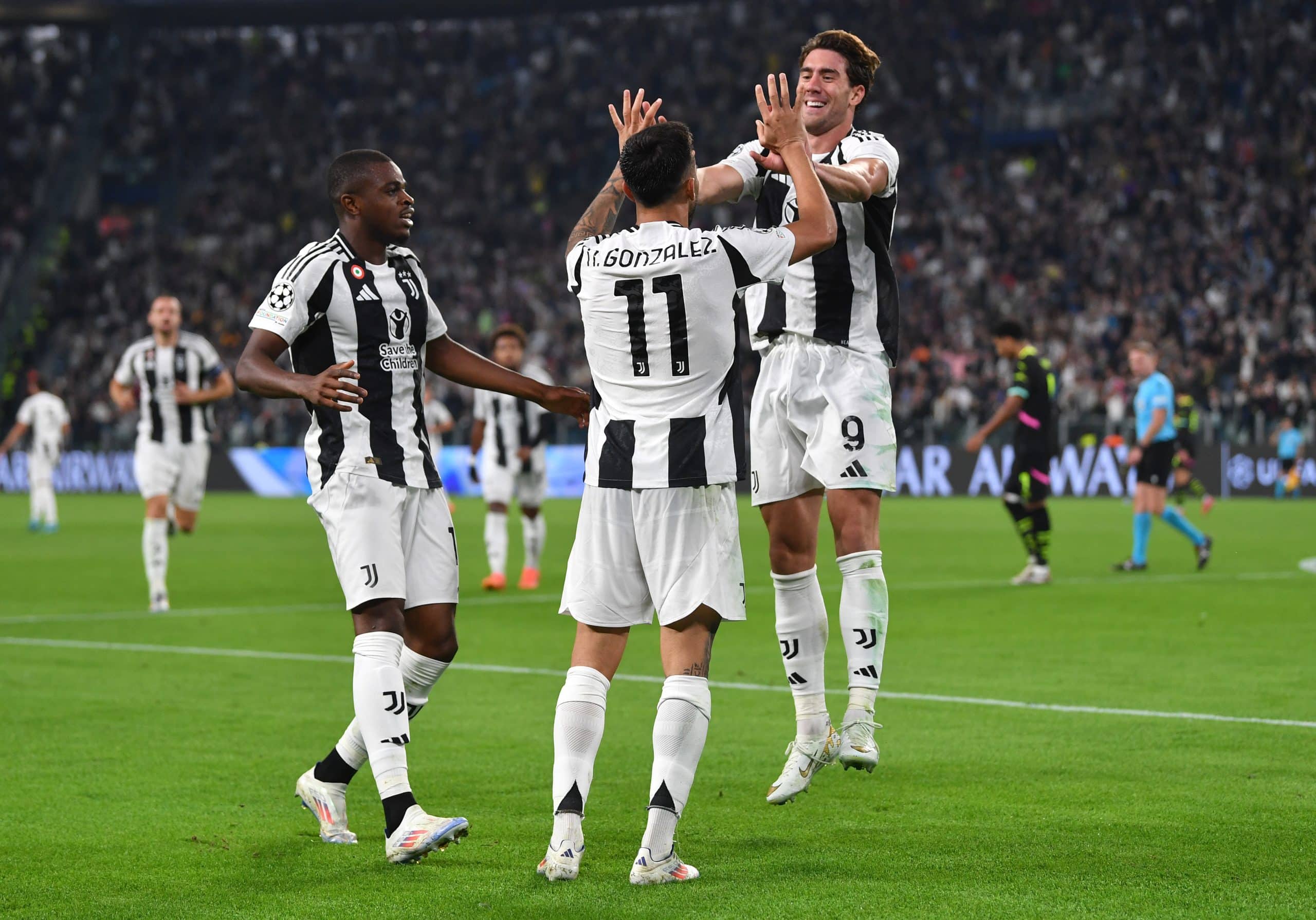 TURIN, ITALY - SEPTEMBER 17: Nicolas Gonzalez of Juventus celebrates scoring his team's third goal with teammate Dusan Vlahovic during the UEFA Champions League 2024/25 League Phase MD1 match between Juventus and PSV Eindhoven at Juventus Stadium on September 17, 2024 in Turin, Italy. (Photo by Valerio Pennicino/Getty Images)