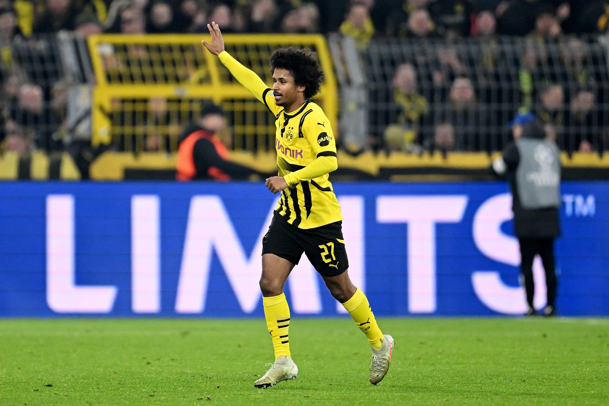 DORTMUND, GERMANY - MARCH 04: Karim Adeyemi of Borussia Dortmund celebrates scoring his team's first goal during the UEFA Champions League 2024/25 Round of 16 first leg match between Borussia Dortmund and LOSC Lille at BVB Stadion Dortmund on March 04, 2025 in Dortmund, Germany. (Photo by Daniel Kopatsch/Getty Images)